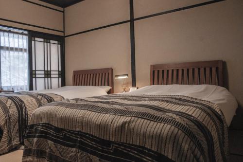Japanese-Style Economy Western Twin bed Room with Shared Bathroom - "Chikyu" - Room Only