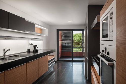 Premium Four-Bedroom Residence with Balcony and Garden View