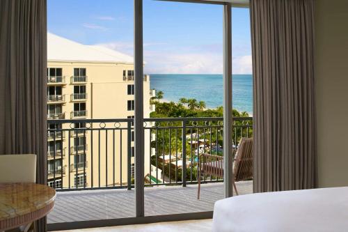 Room with Two Queen Beds, Balcony and Partial Ocean View