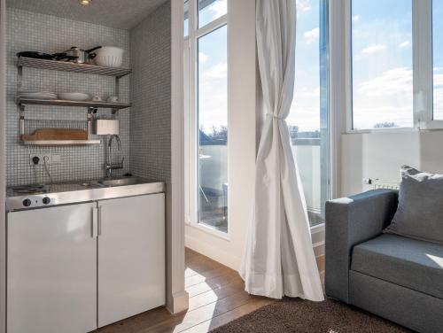 Bedroom Apartment with Balcony and Sofa Bed