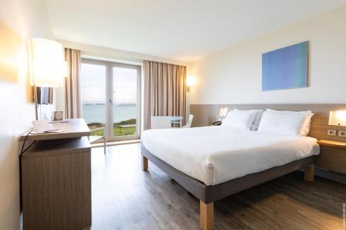 Classic sea side room with one queen size bed located on the upper floor