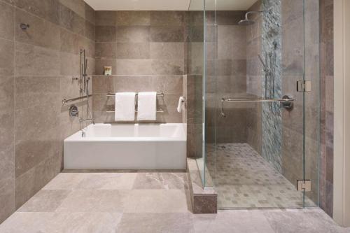 Three-Bedroom Ilikai Villa with Partial Ocean View, One Queen, Two King Beds, and Accessible Tub and Shower
