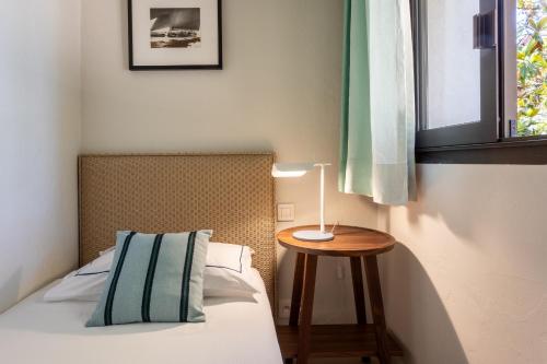 Triple room with a west-facing garden view and a balcony, free access to the spa and private beach