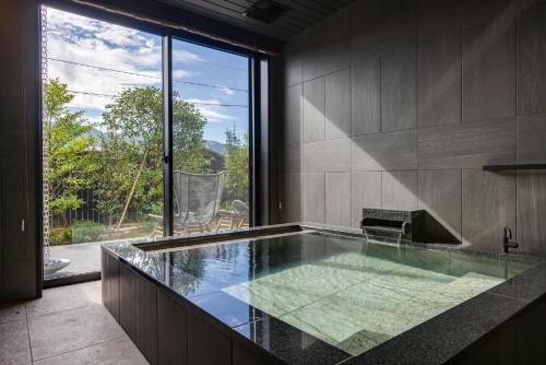 Premium Suite with Semi-Open-Air Bath	