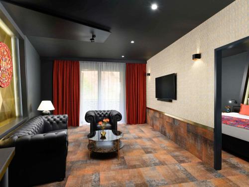 Junior King Suite with Separate Living Room and Pool View
