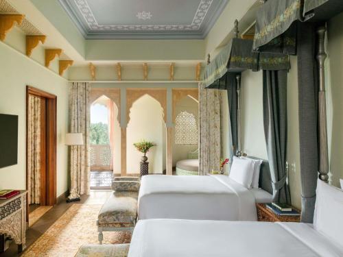 Rajmata Two-Bedroom Presidential Suite with Pool: Airport Transfers in luxury vehicle, 01 Bottle of champagne, INR 5000 hotel credit once during the stay. One 60-minute spa therapy for couple, Evening Hi-Tea at Safir/ Sundowner session with Bartender for