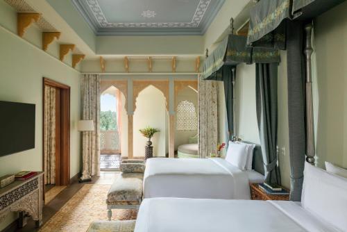 Rajmata Two-Bedroom Presidential Suite with Pool: Airport Transfers in luxury vehicle, 01 Bottle of champagne, INR 5000 hotel credit once during the stay. One 60-minute spa therapy for couple, Evening Hi-Tea at Safir/ Sundowner session with Bartender for