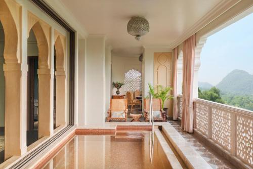 Rajmata Two-Bedroom Presidential Suite with Pool: Airport Transfers in luxury vehicle, 01 Bottle of champagne, INR 5000 hotel credit once during the stay. One 60-minute spa therapy for couple, Evening Hi-Tea at Safir/ Sundowner session with Bartender for