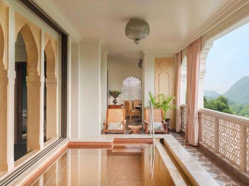 Rajmata Two-Bedroom Presidential Suite with Pool: Airport Transfers in luxury vehicle, 01 Bottle of champagne, INR 5000 hotel credit once during the stay. One 60-minute spa therapy for couple, Evening Hi-Tea at Safir/ Sundowner session with Bartender for