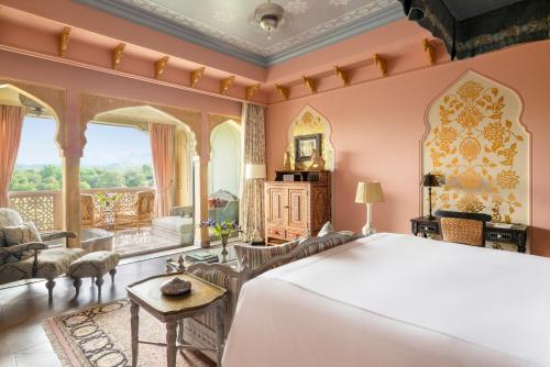 Raffles King Bedroom Suite with Plunge Pool & Balcony:Enjoy INR 4000 daily dining credit, one-time INR 4000 spa credit, signature Jaipur Sling at Writers Bar and 45-min Mineral Pool experience. Mughal-inspired interiors, private plunge pool with Aravallis