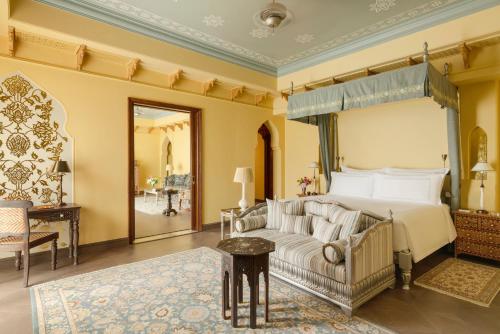 Maharani One King Bedroom Royal Suite with Pool: Airport Transfers in luxury vehicle, 01 Bottle of wine, INR 5000 hotel credit once during the stay. One 60-minute couple spa therapy. Evening Hi-Tea / Sundowner with Bartender, Butler Service