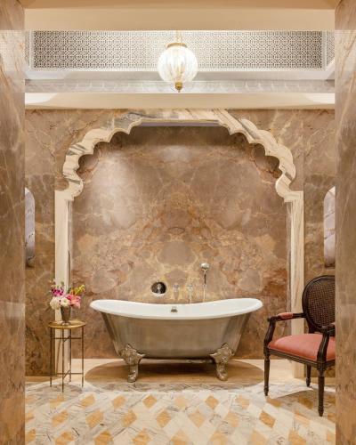 Maharani One King Bedroom Royal Suite with Pool: Airport Transfers in luxury vehicle, 01 Bottle of wine, INR 5000 hotel credit once during the stay. One 60-minute couple spa therapy. Evening Hi-Tea / Sundowner with Bartender, Butler Service