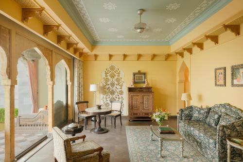 Maharani One King Bedroom Royal Suite with Pool: Airport Transfers in luxury vehicle, 01 Bottle of wine, INR 5000 hotel credit once during the stay. One 60-minute couple spa therapy. Evening Hi-Tea / Sundowner with Bartender, Butler Service