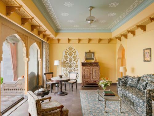 Maharani One King Bedroom Royal Suite with Pool: Airport Transfers in luxury vehicle, 01 Bottle of wine, INR 5000 hotel credit once during the stay. One 60-minute couple spa therapy. Evening Hi-Tea / Sundowner with Bartender, Butler Service