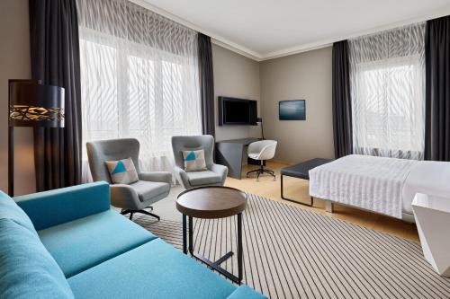 Superior Guest Room with Sofa Bed and Courtyard View
