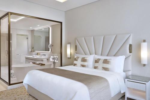 Grand Deluxe King Room with Partial Sea View, KYMA beach access, Signature St. Regis Butler Service