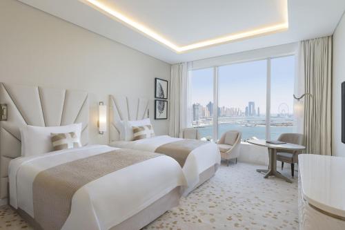 Grand Deluxe Twin Room with Partial Sea View, KYMA beach access, Signature St. Regis Butler Service