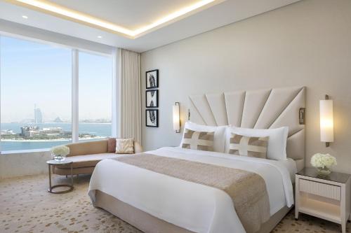 Grand Deluxe Suite with Sea View, KYMA beach access, Signature St. Regis Butler Service