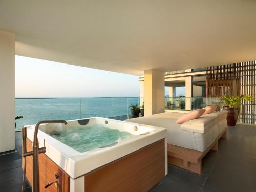 Three-Bedroom Presidential Suite - Dedicated butler, breakfast at Alizee or in-room dining, daily sunset Aperitivo served in the suite, and a round-trip airport transfer with Complimentary Rainforest Experience once per stay
