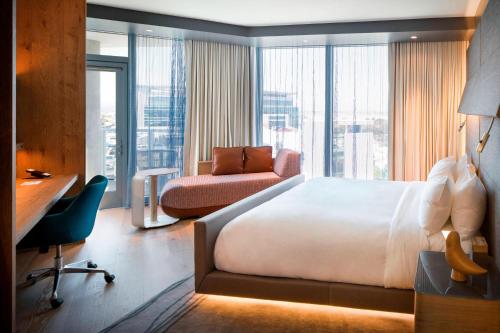 Corner King Guest Room with Balcony and Partial Bay View