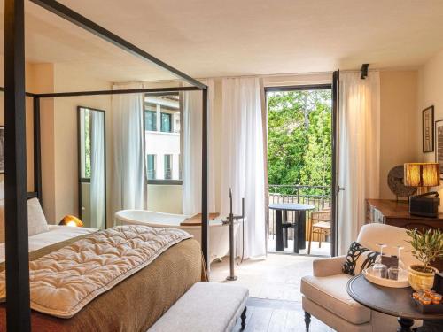 Junior King Suite with Balcony and Pool View