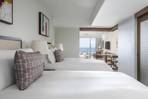 Deluxe One-Bedroom Suite with Two Double Beds and Ocean View