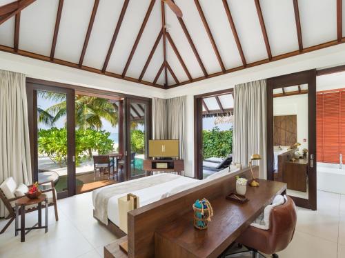 Sunset Pool Beach Villa - Personalized Butler Service | Private Sea Plane Lounge Access | Kids Club with Optional Nanny Services | Maldivian Traditional Village Experience | Access to 5 Exceptional Dine-Around Outlets