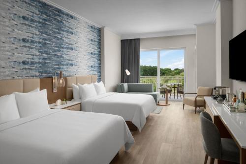 Queen Room with Two Queen Beds and Pool View - Hearing Accessible