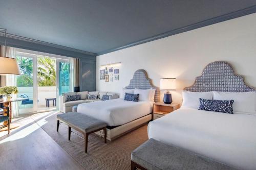 Deluxe Queen Room with Two Queen Beds and Balcony - City View