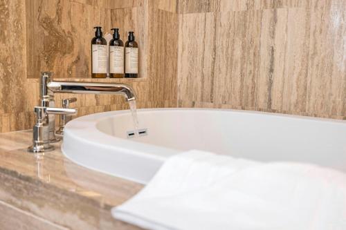 Deluxe Queen Room with City View and Balcony - Mobility/Hearing Accessible with Roll-In Shower