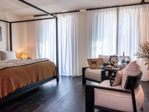 Junior King Suite with Balcony and Pool View