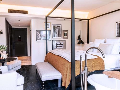 Junior King Suite with Balcony and Pool View
