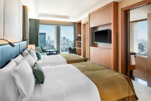 Large Grand Deluxe Room with Two Double Beds and City View