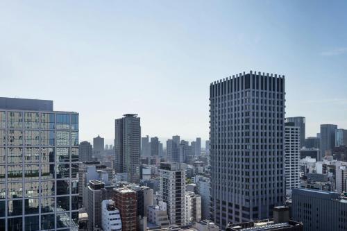 Large Grand Deluxe Room with Two Double Beds and City View
