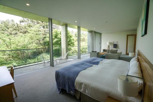 Suite with Sofa Bed and Open-Air Bath Lower Level Floor