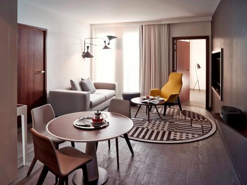King Suite with Sofa Bed and Lounge Area - Pool View