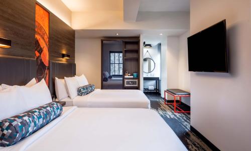 Corner Double Room with Two Queen Beds and City View