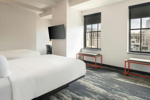 Corner Double Room with Two Queen Beds and City View