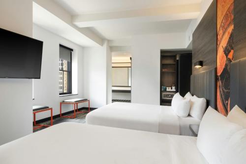 Corner Double Room with Two Queen Beds and City View