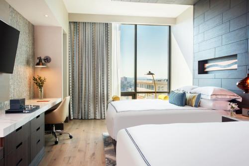 Essential Queen Room with Two Queen Beds and Mountain View
